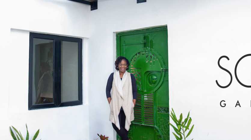 Tola Akerele founder SOTO Gallery standing in front of the gallery